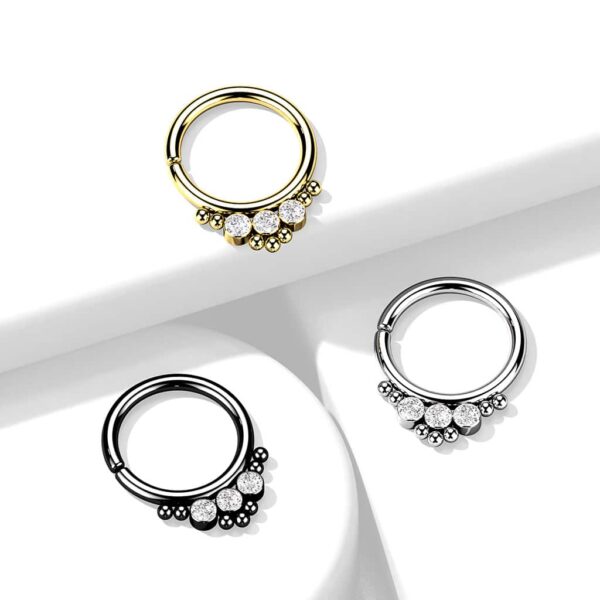 Buigbare ring van chirurgisch staal met ronde steentjes en balletjes