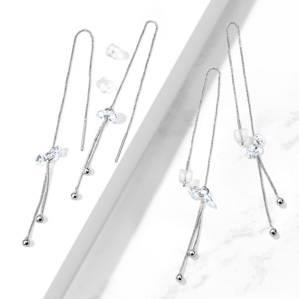 Paar threader oorbellen met hangende balletjes en steentjes